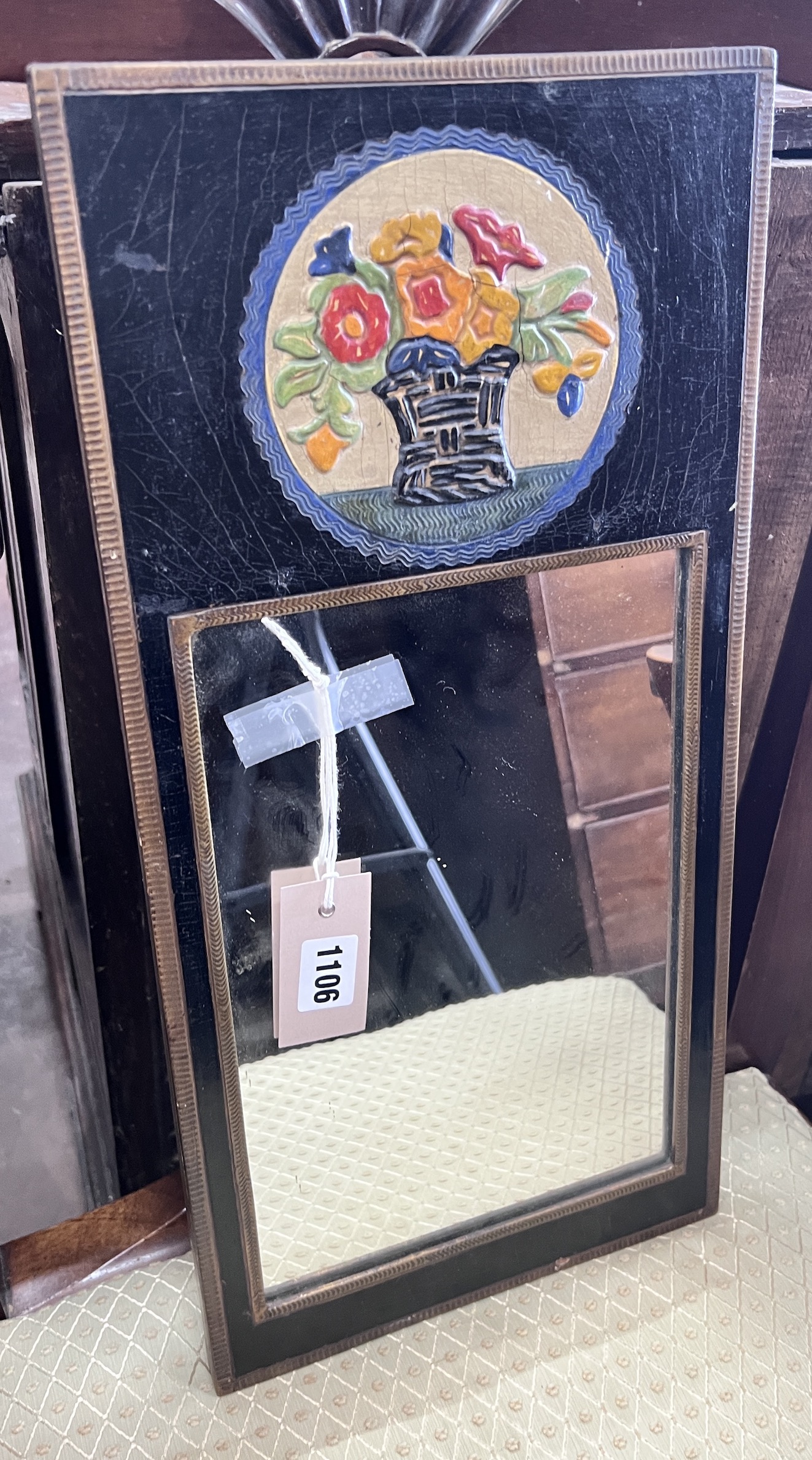 A small mid century rectangular painted and embossed wall mirror, width 124cm, height 50cm